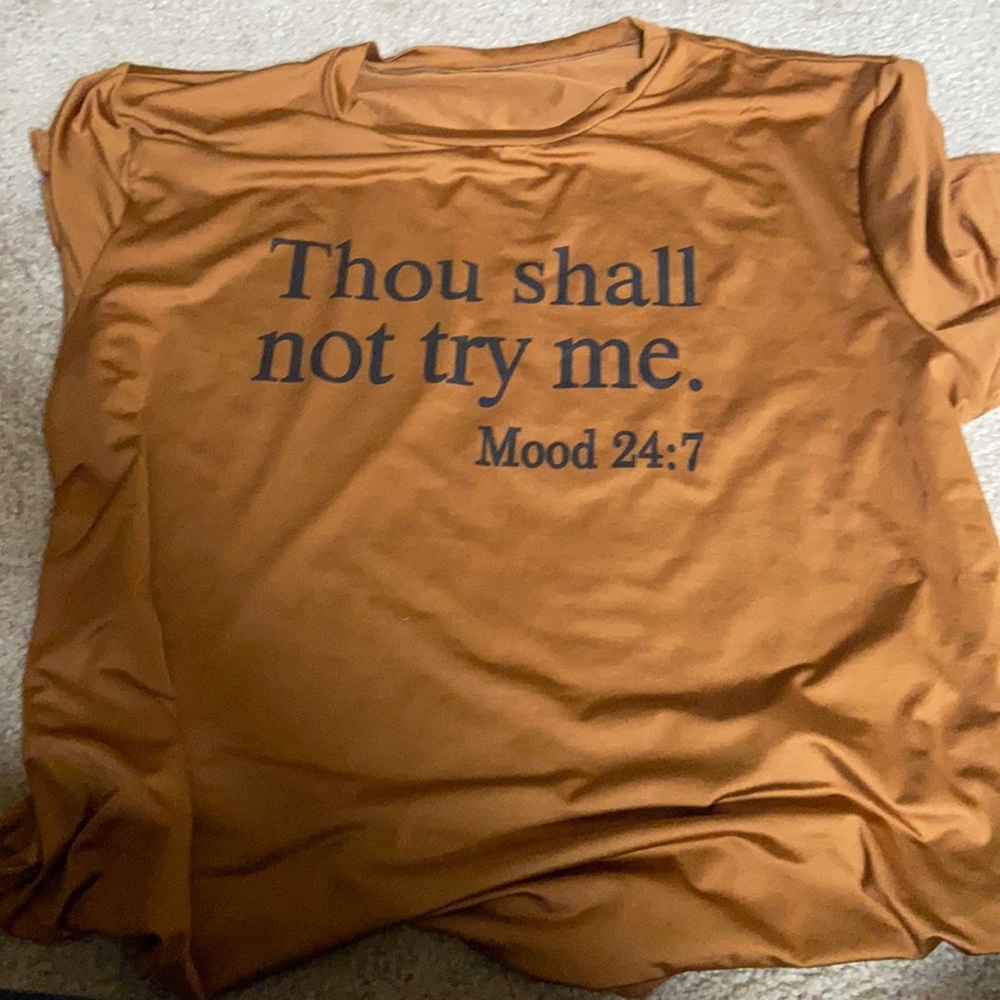 Short sleeve tee shirt. “Thou shall not try me”.